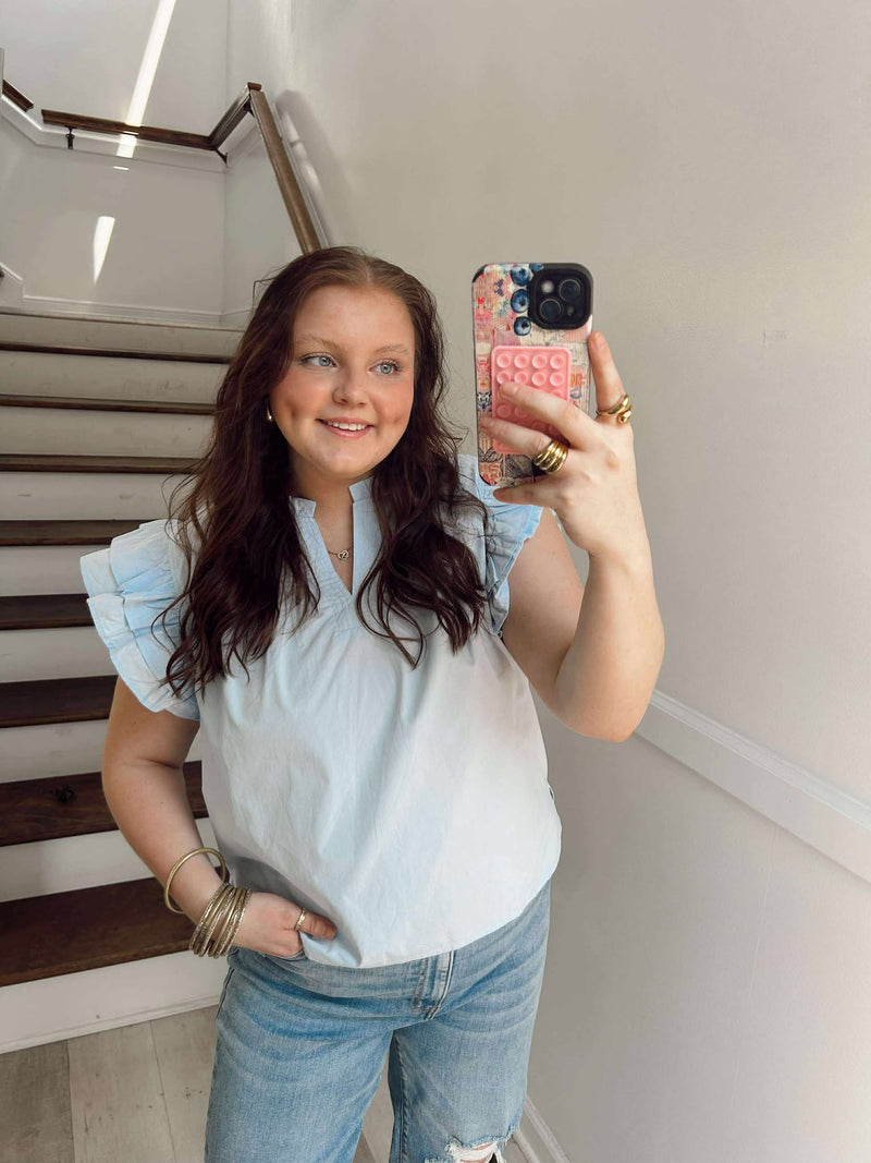 Powder blue ruffly shoulder top